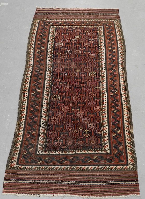 Appraisal: Persian Belouch Carpet Rug Runner Persia Circa Central burgundy and