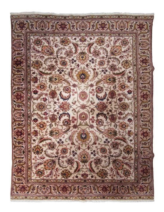 Appraisal: Tabriz Rug having allover scrolling foliate decoration on an ivory