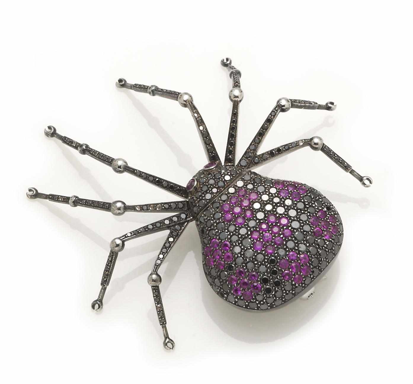 Appraisal: A pink sapphire and black diamond spider brooch articulated legs