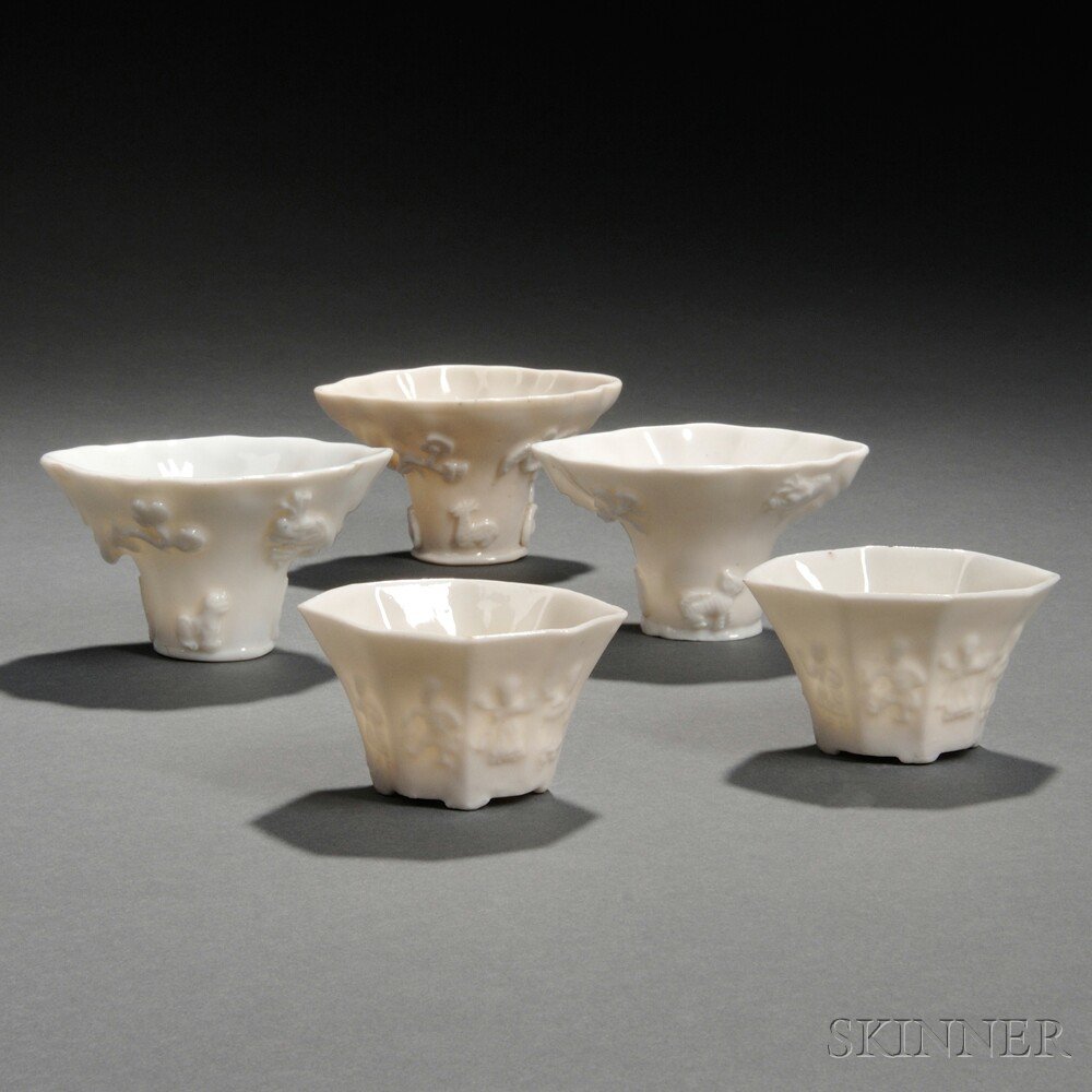 Appraisal: Five Blanc-de-Chine Cups China Qing Dynasty three rhinoceros horn cup