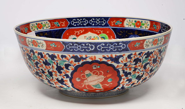 Appraisal: AN OLD IMARI BOWL decorated with cartouches of birds and