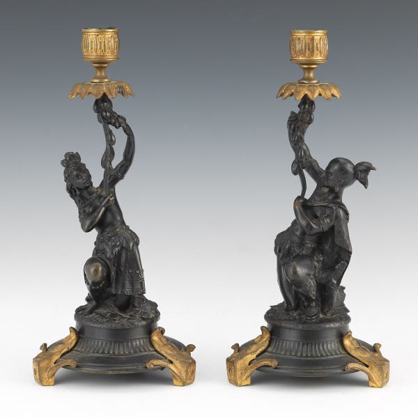 Appraisal: PAIR OF FIGURAL LOUIS XV STYLE CANDLEHOLDERS Pair of bronze