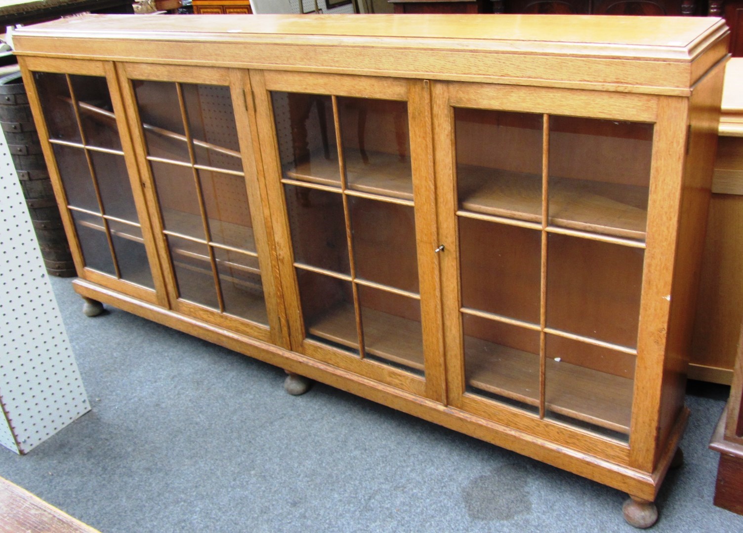 Appraisal: An early th century oak floor standing glazed four door