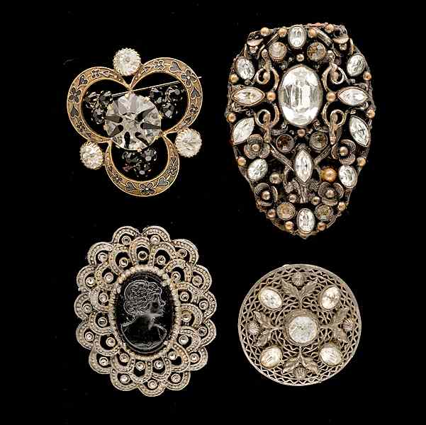 Appraisal: Grouping of four unsigned brooches A grouping of unsigned jewelry