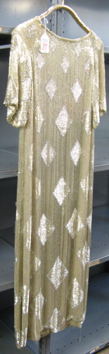 Appraisal: A LADY'S FLAPPER ERA EVENING DRESS having all-over tube-shaped glass