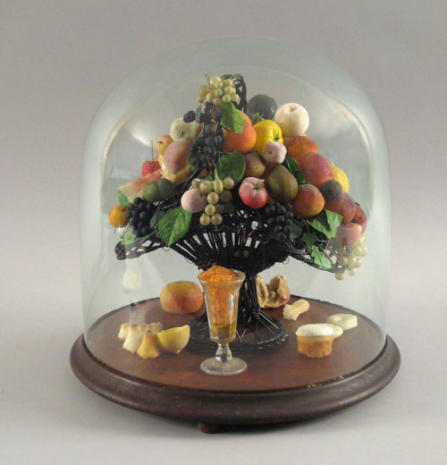 Appraisal: Basket of wax fruit with glass dome ca h