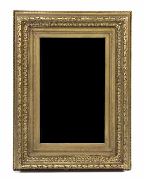 Appraisal: A Victorian Giltwood Mirror having a rectangular beveled plate within