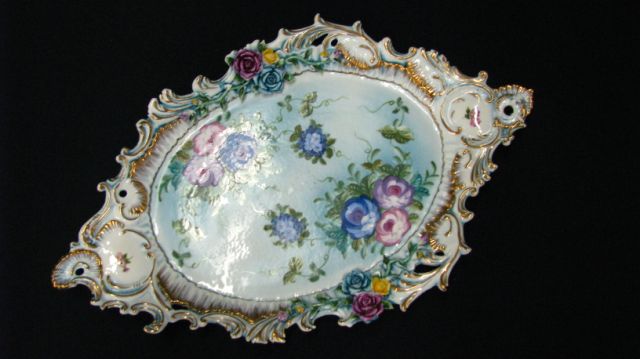 Appraisal: Oval hand-decorated Dresden platter molded and painted floral motif Inches