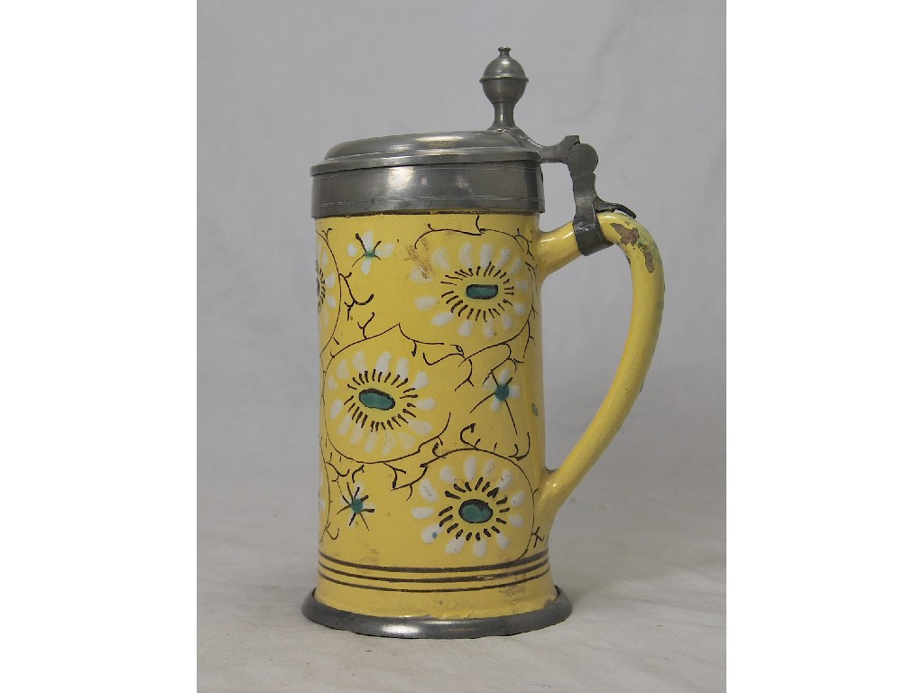 Appraisal: A th century German yellow glazed faience stein with pewter