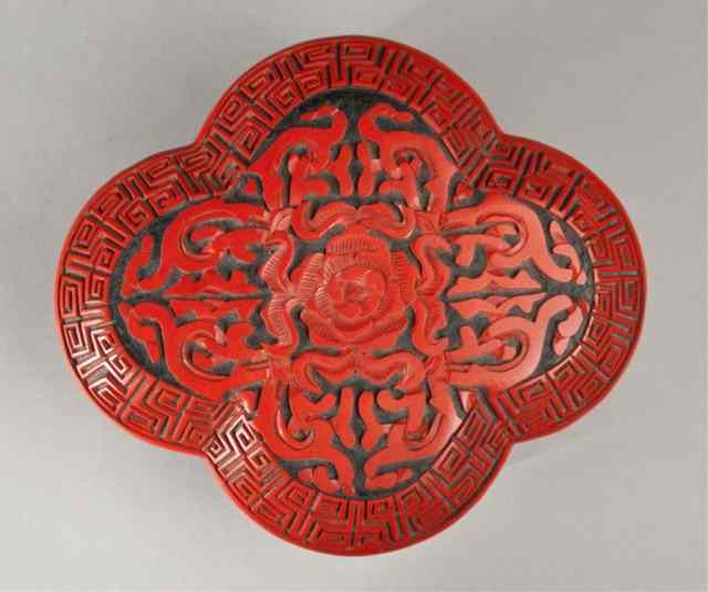 Appraisal: Chinese Cinnabar Style Box and CoverThe cartouche shaped box finely