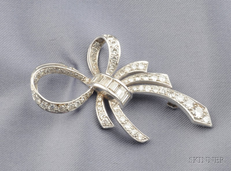 Appraisal: Platinum and Diamond Bow Brooch set with full and baguette-cut