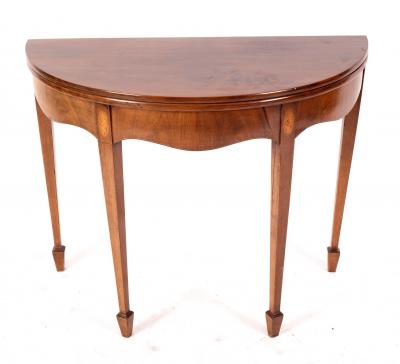 Appraisal: A George III mahogany half-round tea table circa the fold