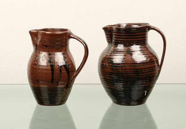 Appraisal: Abuja PotteryTwo jugstenmoku glaze one with brown concentric lines the