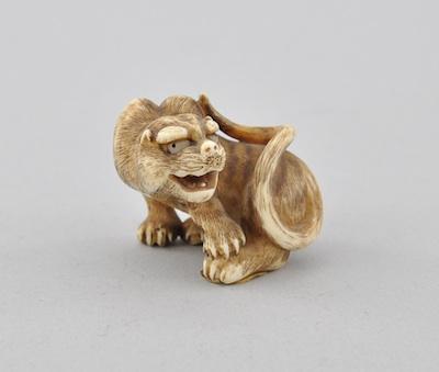 Appraisal: An Open Mouthed Cat Okimono Carved ivory with open work