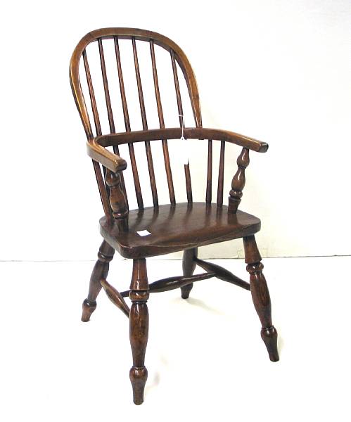 Appraisal: A mixed wood English Windsor child's armchair th century height