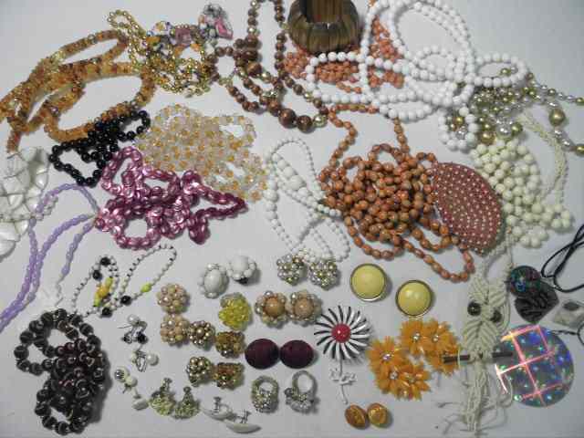 Appraisal: Lot of assorted ladies costume jewelry and a handled travel