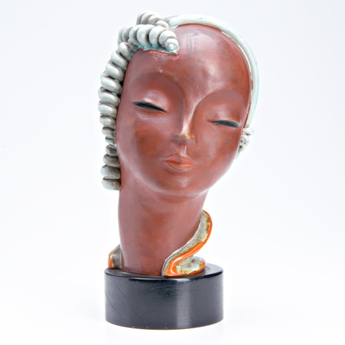 Appraisal: GOLDSCHEIDER Ceramic sculpture of a head her curls glazed in