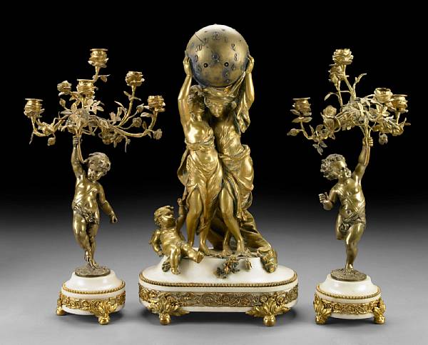 Appraisal: A Louis XV style gilt bronze mounted marble clock garniture