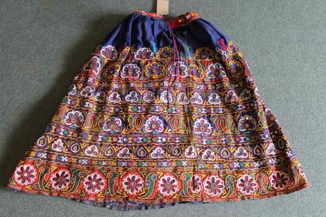 Appraisal: A RAJASTHANI WEDDING SKIRT with polychrome embroidered and mirrored decoration