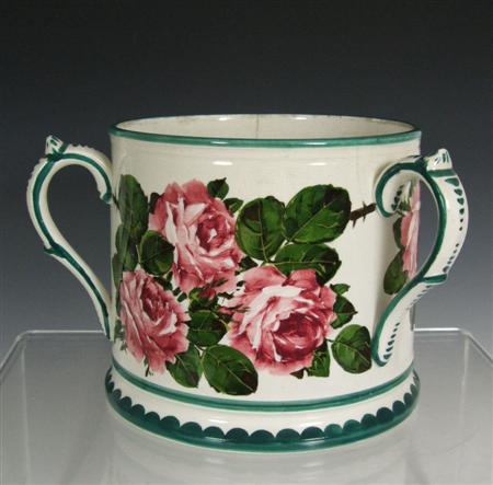 Appraisal: WEMYSS THREE-HANDLED TYG CIRCA glazed earthenware decorated with cabbage roses