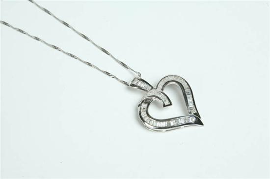 Appraisal: DIAMOND HEART PENDANT White gold Fifty-nine tapered and straight baguette