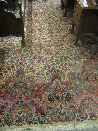 Appraisal: KARASTAN AMERICAN ORIENTAL CARPET Kerman design overall floral decoration on