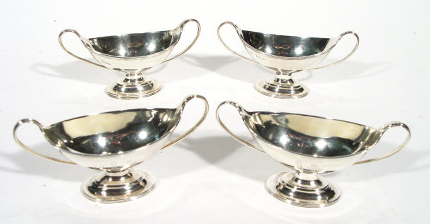 Appraisal: Set of four Victorian two handled silver boat shaped salts