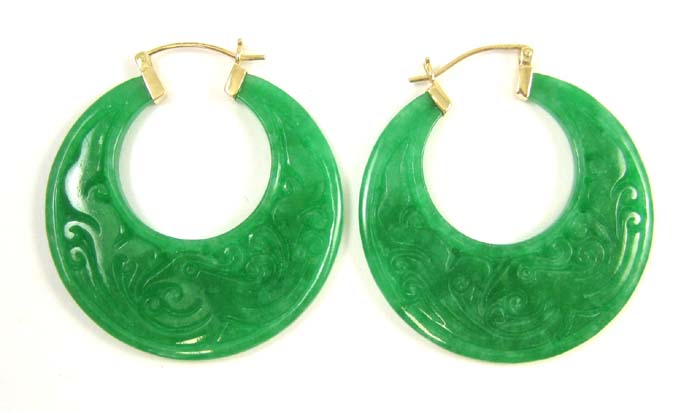 Appraisal: PAIR OF JADE HOOP EARRINGS each with large carved green