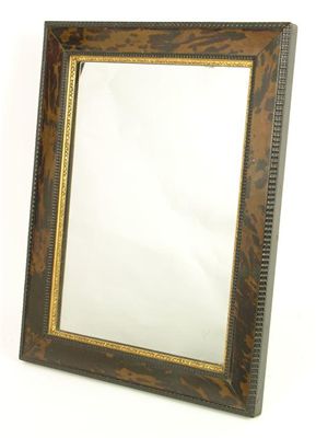 Appraisal: A tortoiseshell easel back mirror with a rectangular plate giltwood