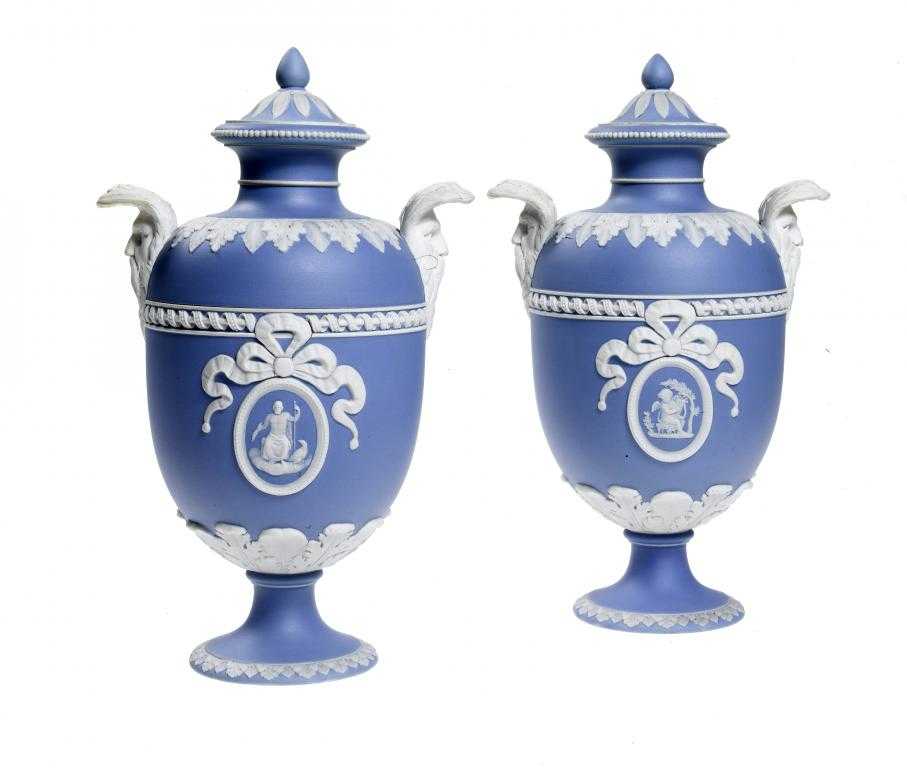 Appraisal: A PAIR OF WEDGWOOD JASPER WARE OVIFORM VASES AND COVERS