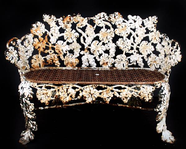 Appraisal: A cast iron paint decorated garden bench with grape and