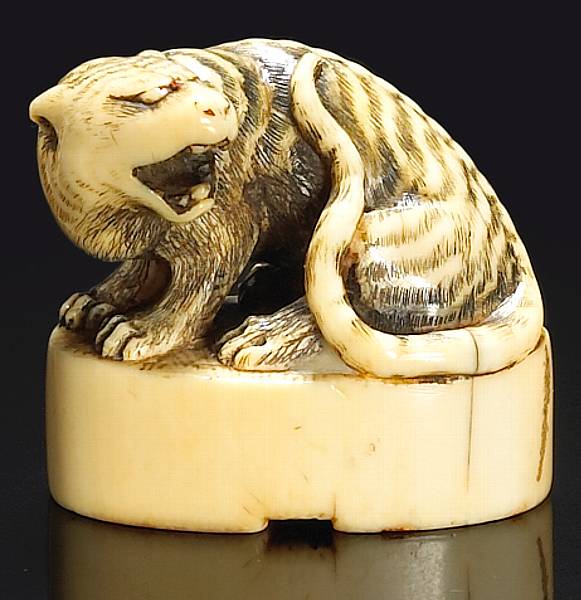 Appraisal: An ivory seal-form netsuke th Century The crest finely carved