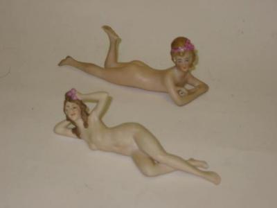 Appraisal: A pair of bisque bathing belles one modelled lying on