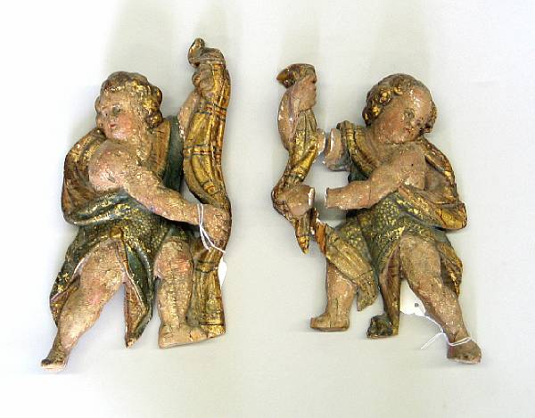 Appraisal: A pair of Italian painted and parcel gilt carved wood