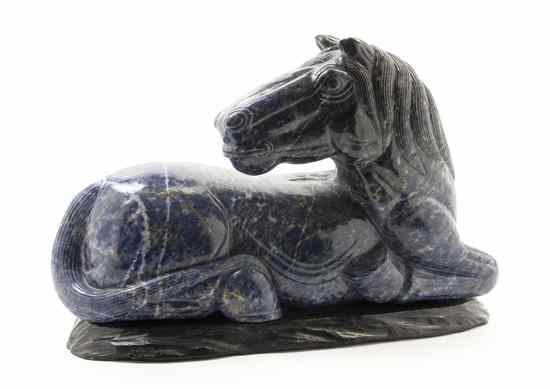 Appraisal: A Lapis Carved Horse depicted kneeling set on a cast