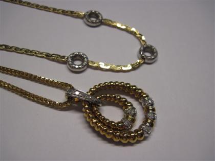 Appraisal: Two karat yellow gold necklacesOne with oval diamond set pendant