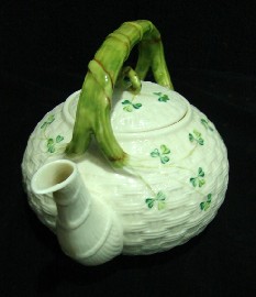 Appraisal: A Belleek porcelain tea pot modelled with weave form body