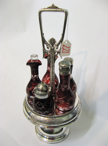 Appraisal: BOHEMIAN GLASS AND SILVER PLATED CASTOR SET having red cut