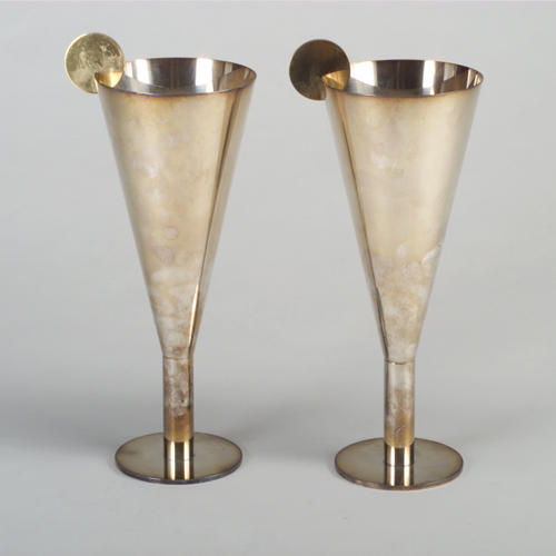 Appraisal: Pair of Poaova Argenti large silver-plated goblets each with brass