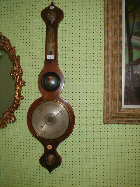 Appraisal: An early thC string inlaid mahogany wheel barometer with onion