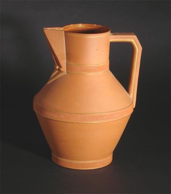 Appraisal: A Watcombe Pottery terracotta jug designed by Dr Christopher Dresser