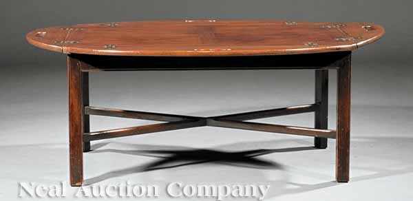 Appraisal: A Chippendale-Style Mahogany Tray on Stand hinged sides with cut-out