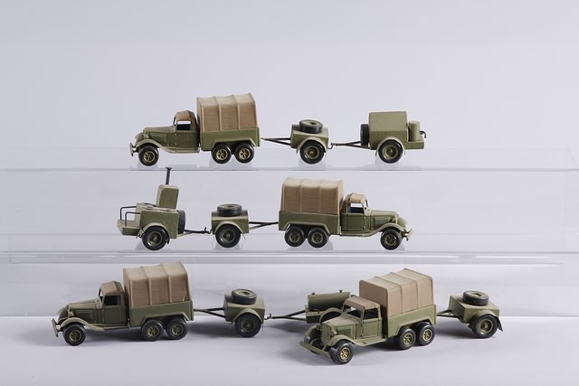 Appraisal: Lot of plastic Tootsie toy army vehicles together with trailers