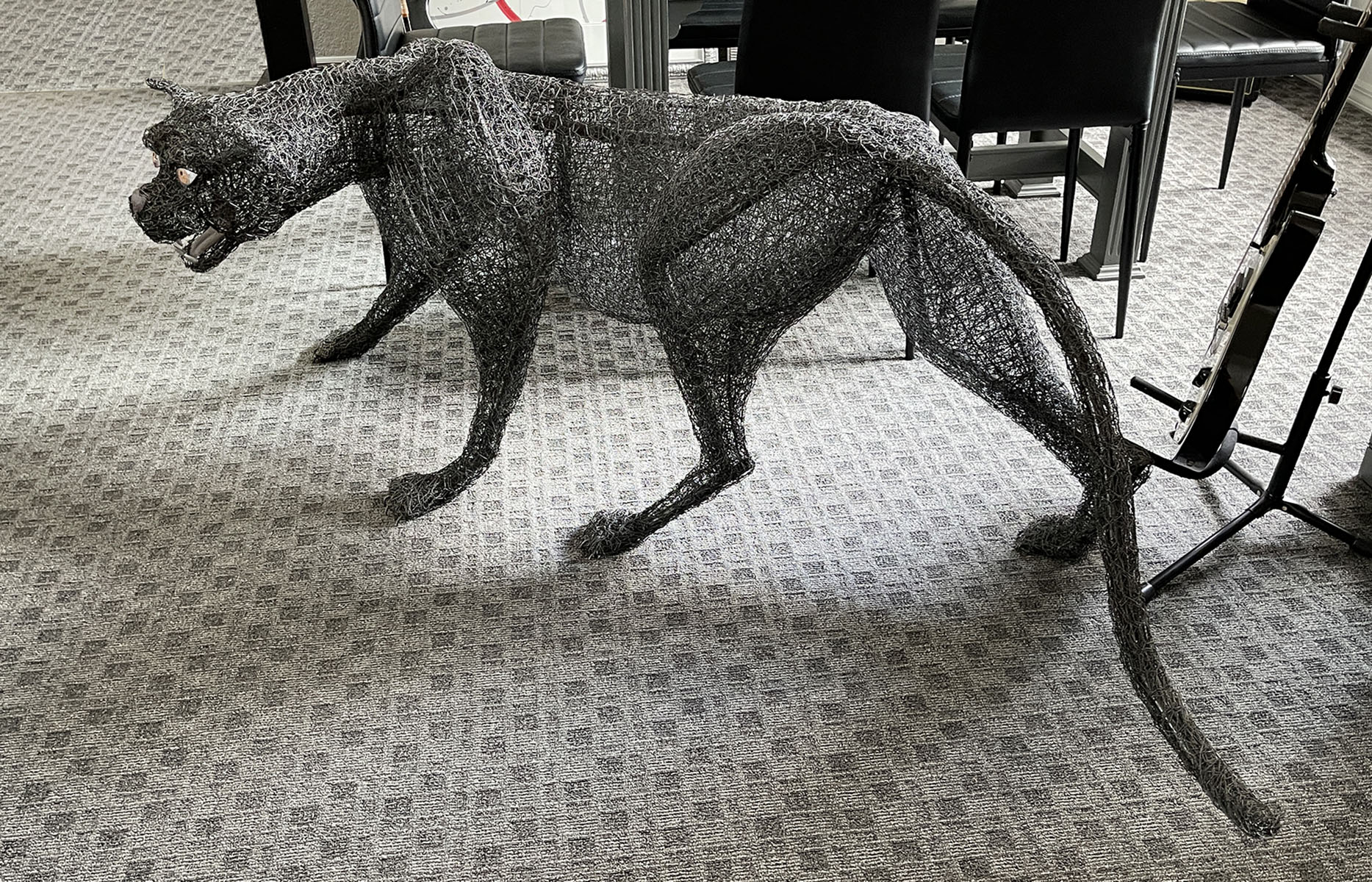 Appraisal: STUART PETERMAN WIRE MESH SCULPTURE OF A PANTHER ''h x