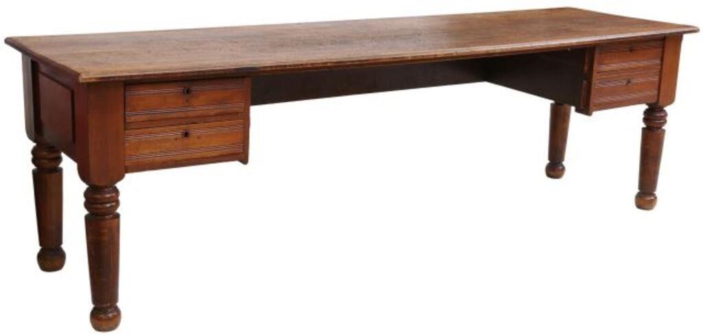 Appraisal: Large American walnut desk late th century having two-plank top