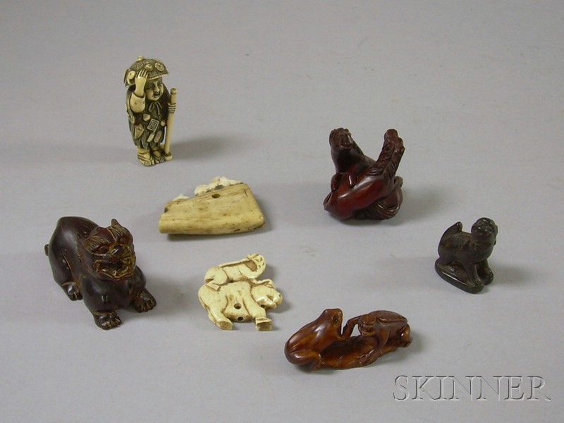 Appraisal: Six Netsukes and a Bone Pendant a horn foo dog