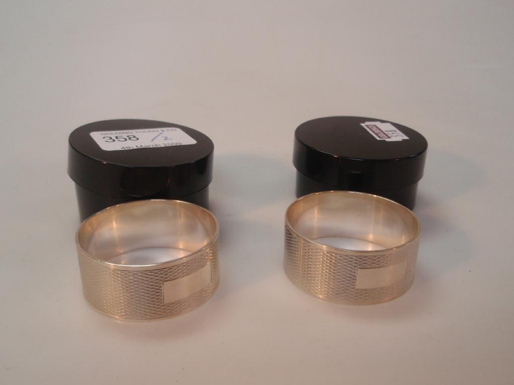 Appraisal: A pair of silver engine turned napkin rings Birmingham