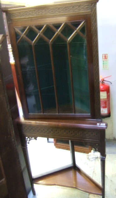 Appraisal: An Edwardian mahogany corner cabinet on stand of Chippendale style