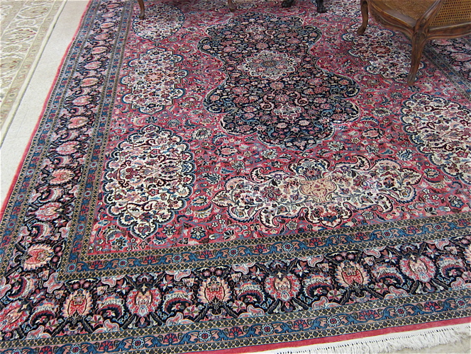 Appraisal: FINE HAND KNOTTED ORIENTAL CARPET Indo-Persian intricate flower-filled medallion and