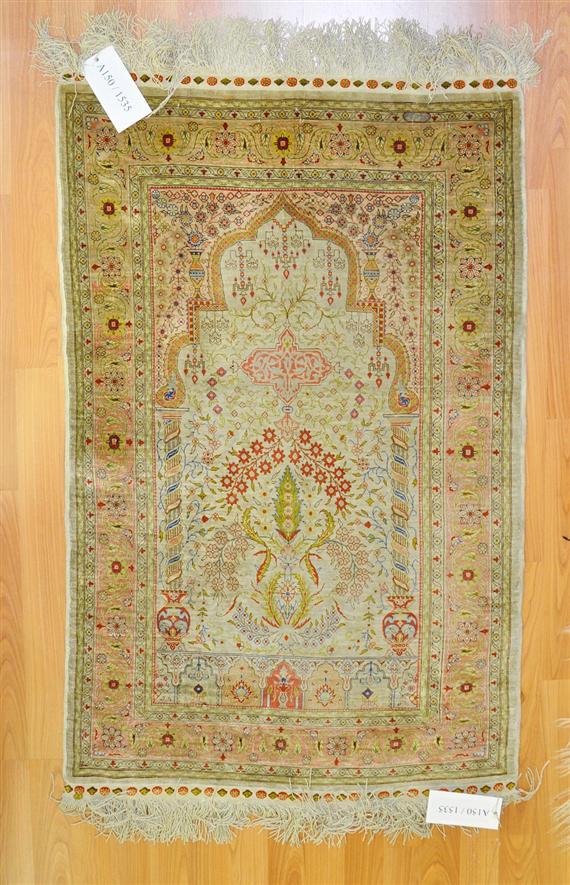 Appraisal: HEREKE SILK PRAYER Grey mihrab with pink spandrels The entire